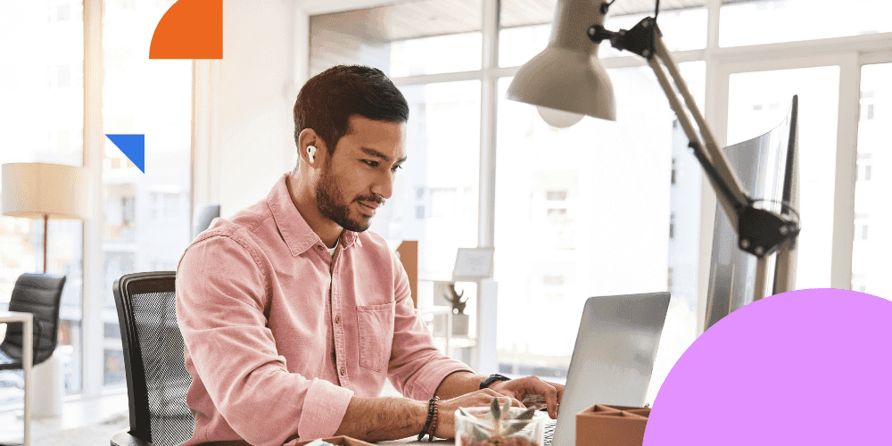 Focused man engaged in productive work on a laptop for enhanced efficiency and performance